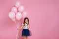 Child girl posing with pastel pink air balloons Royalty Free Stock Photo