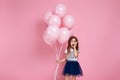 Child girl posing with pastel pink air balloons Royalty Free Stock Photo