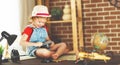 Child girl preparing to travel with a card and photo camera Royalty Free Stock Photo