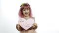Child girl princess holds pink paper heart with text about mother. Mother`s day Royalty Free Stock Photo