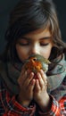 Child girl promoting animal protection, gently holding small bird, demonstrating care and compassion