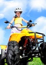 Child girl rides on quad Royalty Free Stock Photo