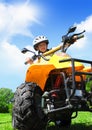 Child girl rides on quad Royalty Free Stock Photo