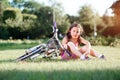 Child girl riding bicycle on summer sunset in the park. Royalty Free Stock Photo