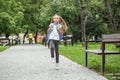 Child girl runs from school with a backpack. The concept of school, study, education, friendship Royalty Free Stock Photo