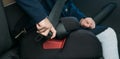 Child-girl in a child seat, clips on independently, being in the car, before the trip Royalty Free Stock Photo