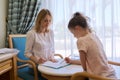 Child girl at session with social worker, school psychologist in office Royalty Free Stock Photo