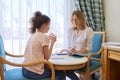 Child girl at session with social worker, school psychologist in office Royalty Free Stock Photo