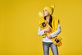 child girl with skateboard blowing a big bubble gum Royalty Free Stock Photo