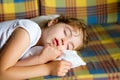 Child girl sleeping bed in retro vintage quilt Royalty Free Stock Photo