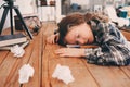 child girl sleeping while doing homework. School kid learning hard and get tired