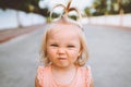 Child girl smiling face portrait cute baby 1 year old candid emotions blond hair funny kid Royalty Free Stock Photo