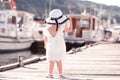 Child girl standing at sea pier Royalty Free Stock Photo