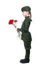 Child girl standing in a uniform with red flowers sideways, on a white background Royalty Free Stock Photo