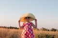 Child girl in straw hat dress in wheat field. Smiling kid in sunglasses sunset countryside. Cottagecore style aesthetic Royalty Free Stock Photo