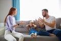 Child girl is suffering from quarrels between parents in the family at home Royalty Free Stock Photo