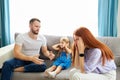 Child girl is suffering from quarrels between parents in the family at home