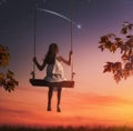 Child girl on swing Royalty Free Stock Photo