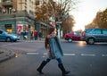 Child girl is walking across the city road at the crosswalk in e Royalty Free Stock Photo