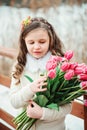 Child girl on warm winter forest walk, soft toned Royalty Free Stock Photo