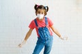 Child girl wearing a protection mask against coronavirus during Covid-19 pandemic Royalty Free Stock Photo