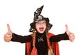 Child girl witch in black costume with thumb.