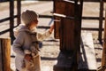 Child girl with wooden bird houses on country side Royalty Free Stock Photo