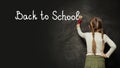 Child girl writing on the blackboard with brush. Back to school, study, education, success concept Royalty Free Stock Photo