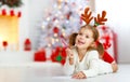 Child girl writing letter santa home near Christmas tree Royalty Free Stock Photo