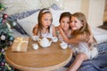 Child girls wake up in her bed in Christmas morning Royalty Free Stock Photo