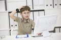 A child with glasses at the computer. Royalty Free Stock Photo