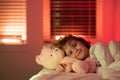 Child go to sleep in the night in the bedroom. Cute little boy asleep in bed. Royalty Free Stock Photo