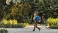 The child goes to school. boy schoolboy goes to school in the morning. happy child with a briefcase on his back and textbooks in Royalty Free Stock Photo