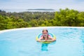 Child with goggles in swimming pool. Kids swim. Royalty Free Stock Photo