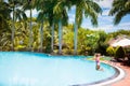 Child with goggles in swimming pool. Kids swim Royalty Free Stock Photo