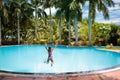 Child with goggles in swimming pool. Kids swim.