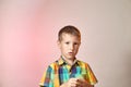 Child on a gradient colored background in a multi-colored shirt Royalty Free Stock Photo