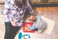 Indoors playing, kid with granny Royalty Free Stock Photo