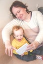 Child and grandmother taking selfie