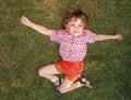 CHILD IN THE GRASS Royalty Free Stock Photo