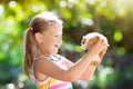 Child with guinea pig. Cavy animal. Kids and pets.