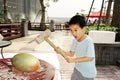 A child hammer a golden egg