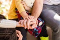 Child hand closeup into parents. Hands of father, mother, keep hand little baby. Parents hold the baby hands. Closeup of Royalty Free Stock Photo