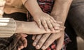 Child hand closeup into parents. Hands of father, mother, keep hand little baby. Parents hold the baby hands. Closeup of Royalty Free Stock Photo