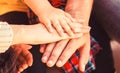 Child hand closeup into parents. Hands of father, mother, keep hand little baby. Parents hold the baby hands. Closeup of Royalty Free Stock Photo