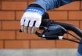 Child hand with Craft glove on handlebars with Shimano brake lever