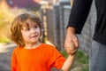 Child hand father. Hands of parent and child outdoors. Parent holds the hand of a small child. Father& x27;s hand lead Royalty Free Stock Photo