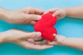 Child hand giving red heart to her dad, Happy family Royalty Free Stock Photo