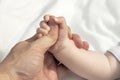 child hand holding fathers thumb Royalty Free Stock Photo