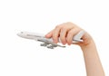 Child hand holding model airplane. Royalty Free Stock Photo